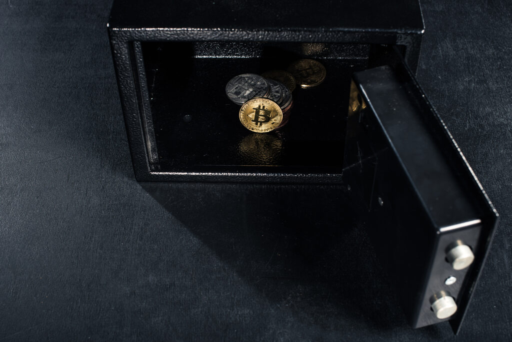 Bitcoin cryptocurrency stacked in open strongbox